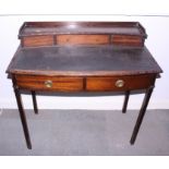 A lady's late 19th century mahogany writing desk with two drawers and square taper supports