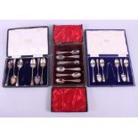 A boxed set of six silver teaspoons with a matched pair of sugar tongs, and a quantity of mixed