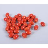 A quantity of loose Peking red glass beads