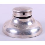 A silver capstan inkwell, the lid with an aperture for a pocket watch, 6" dia at the base (damages)