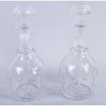 A pair of 19th century cut glass decanters and stoppers, 11" high