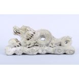 A granite and stone carving of a dragon, 20 1/4" wide