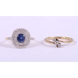 An 18ct gold dress ring, set central sapphire surrounded pave diamonds, with three chip diamonds