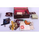 A 19th century mahogany and banded work box, containing a collection of military buttons, buckles,