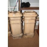 A pair of cream coloured terracotta octagonal chimney pots, 31" high