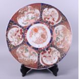 A 19th century Imari porcelain charger, decorated six panels of flowers and birds, 18" dia, and
