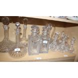 A pair of cut glass spirit decanters, a ships decanter, four onion-shaped decanters and five other
