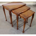 Two burr walnut nests of three occasional tables, on cabriole supports, 21" wide