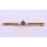 A yellow metal bar brooch,mounted amethyst and four seed pearls, stamped 15ct, 2.6g