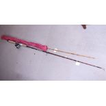 A sea fishing rod and reel and a split cane fishing rod