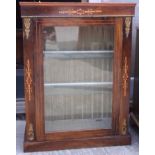 A late 19th century figured walnut and inlaid pier cabinet with gilt brass mounts, 28" wide