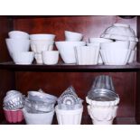 A quantity of ceramic and tin jelly moulds, various sizes and designs