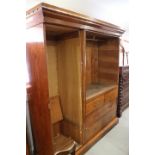 A late 19th century Wellingtonia pine wardrobe, the interior fitted chest of two short and two