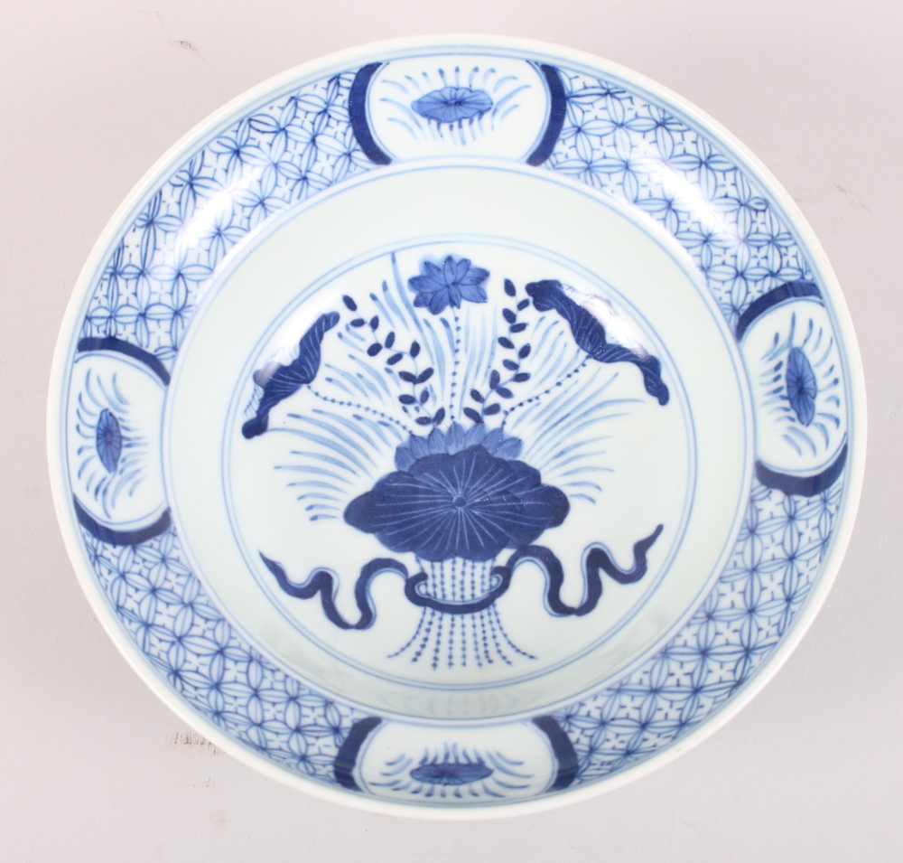A Chinese porcelain blue and white bowl, decorated vase of flowers, six character Kangxi mark to