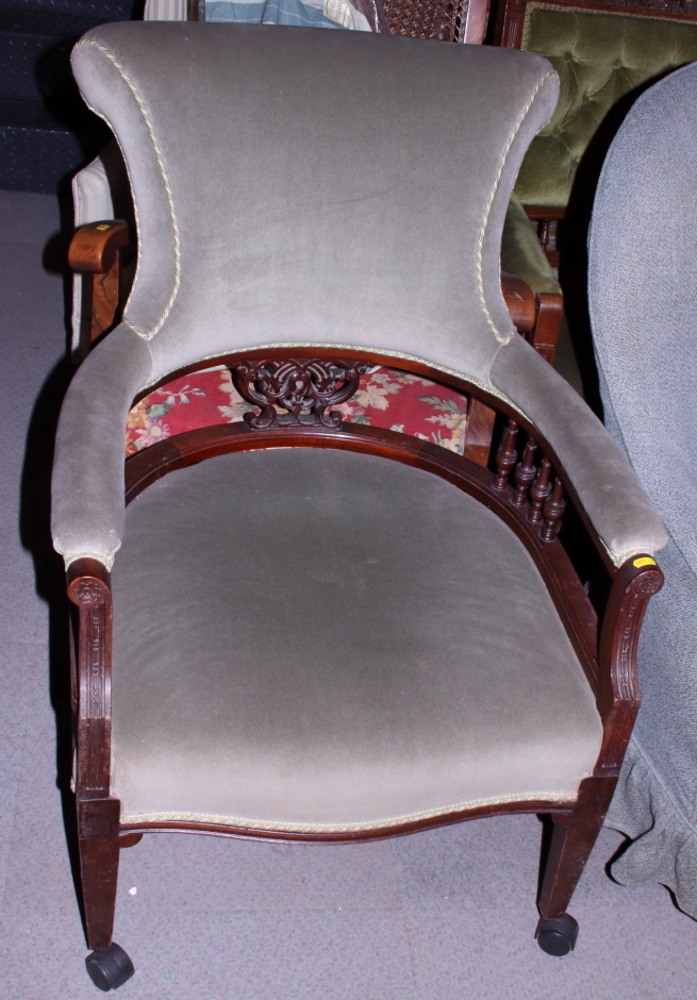 A late Victorian mahogany open armchair with spindle back, on square taper supports