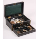 A leather jewellery box, containing a yellow metal brooch stamped 9ct, a 9ct gold pendant, a