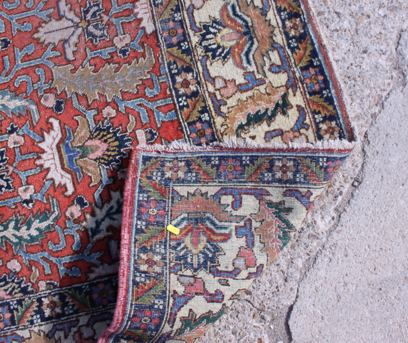A Persian Tabriz rug of traditional design in shades of blue, pink and natural on a red ground, 132" - Image 4 of 5