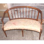 A Sheraton revival mahogany showframe two-seat settee, on turned and tapering supports, 43" wide