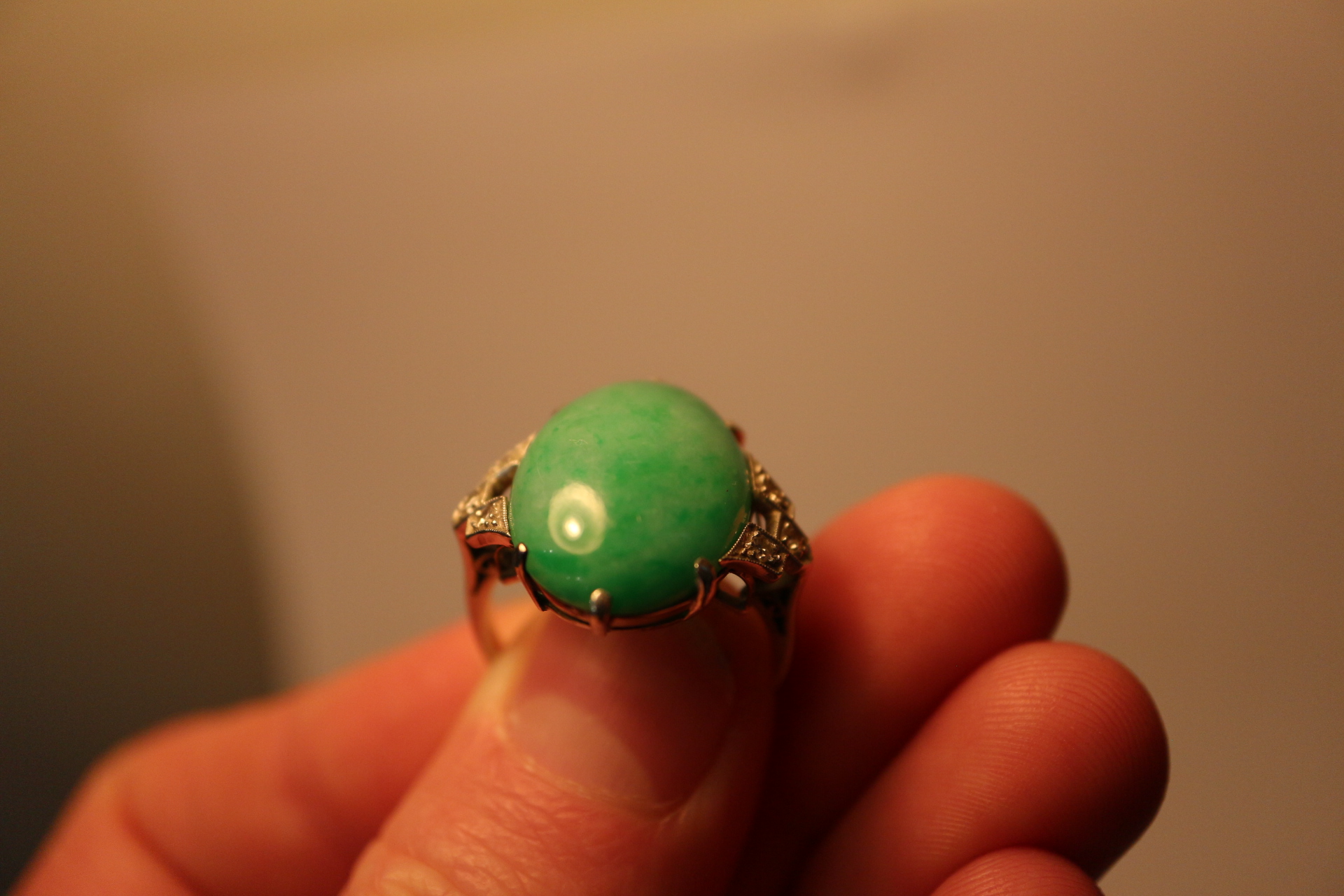 An Art Deco white metal ring, set jade cabochon, flanked three diamonds to each shoulder, ring - Image 7 of 10