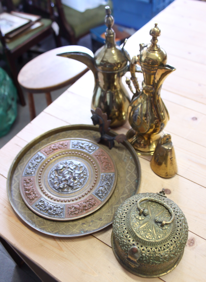 Two brass dallah coffee pots, a brass tray, a box, a bell, etc