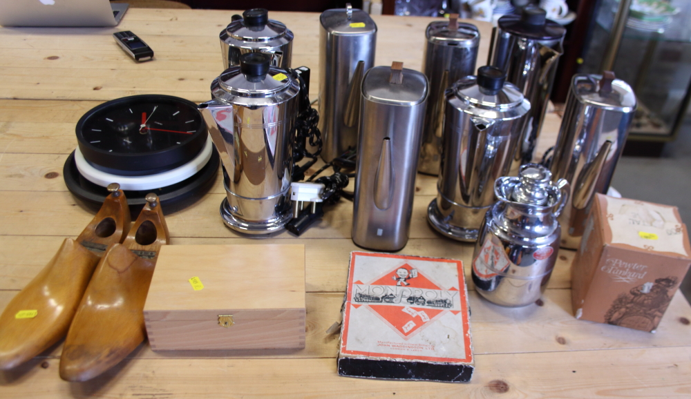 Eight retro coffee percolators, a chess set, a pair of shoe lasts, quartz clocks, bunting, and other