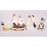 Two 19th century Staffordshire figure groups, an Uncle Tom Staffordshire figure and another group,