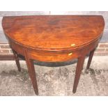 An early 19th century mahogany semicircular fold-over top tea table, on square taper supports, 36"