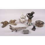 A bronzed figure of a lion, a silver plated model of a pheasant, a plated bottle coaster and other