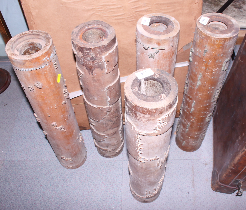 Five early 20th century wooden wallpaper printing rollers with metal detailing and designs, 23"