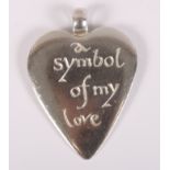 A silver Wright & Teague "a symbol of my love" heart-shaped pendant, complete with box