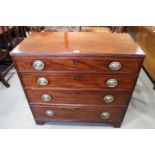 A late Georgian mahogany chest of four long graduated drawers with oval brass handle plates, on