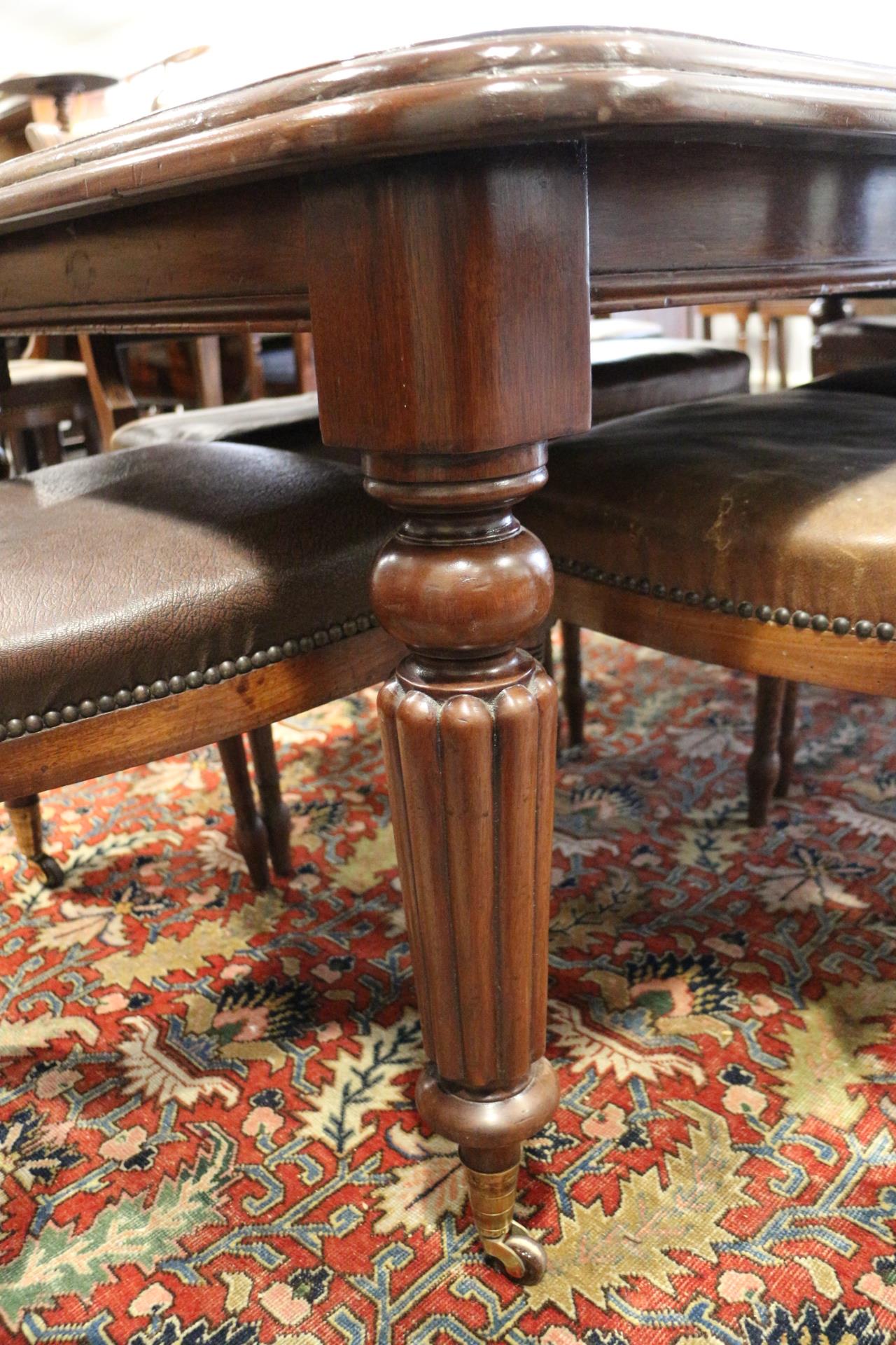 A Victorian mahogany extending dining table with two leaves, on reeded and castored supports, 40" - Image 2 of 7