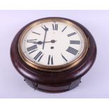 An early 20th century mahogany cased circular wall clock with cream painted dial and Roman numerals,
