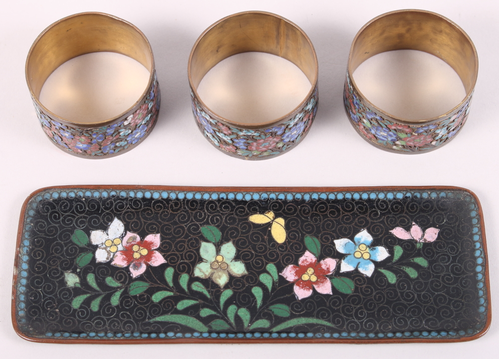 Three cloisonne napkin rings, decorated floral pattern, and a similar cloisonne pin tray, 6 3/4"