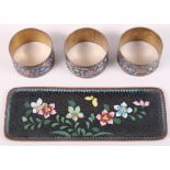 Three cloisonne napkin rings, decorated floral pattern, and a similar cloisonne pin tray, 6 3/4"