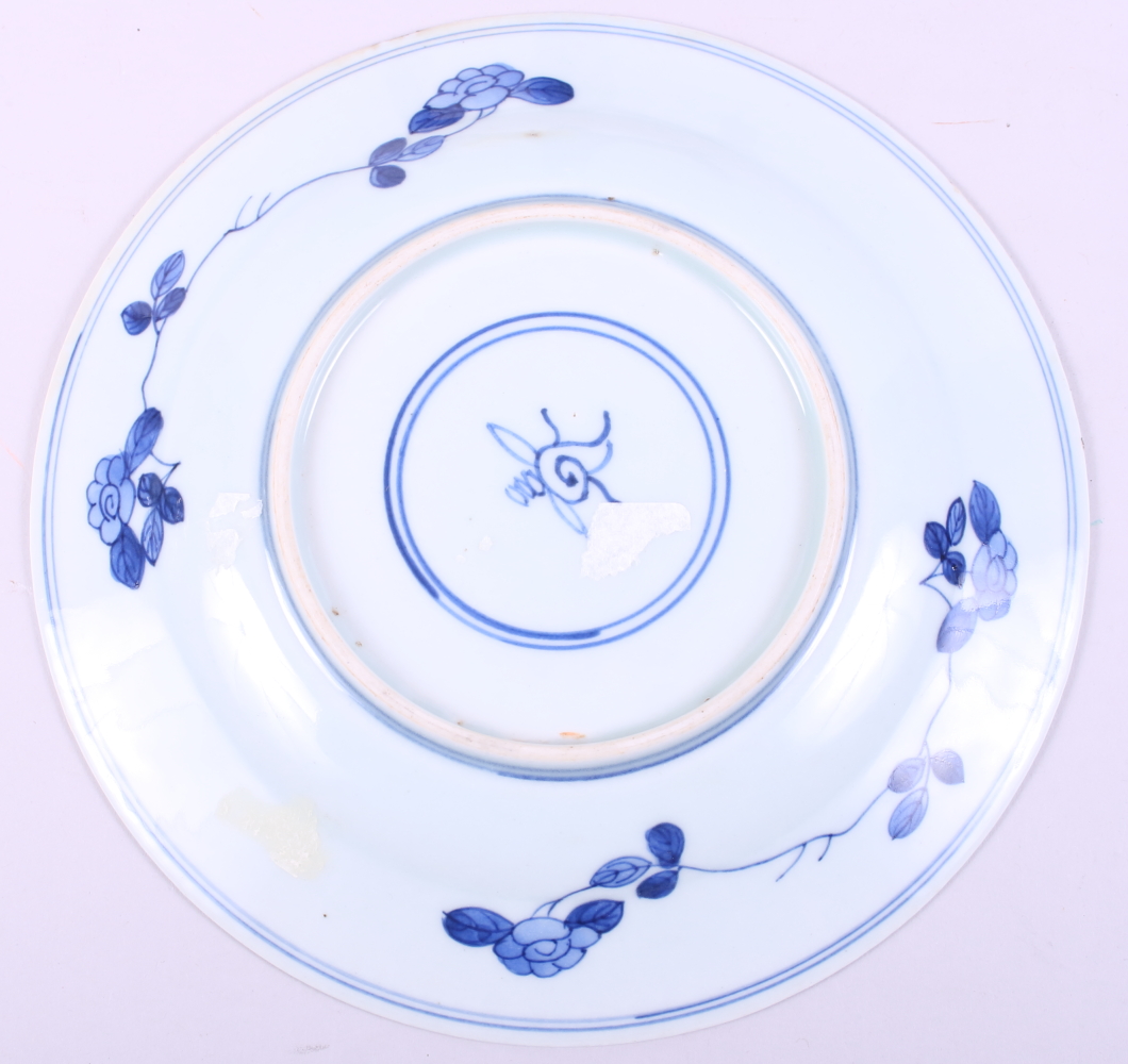 A Chinese blue and white porcelain dish, decorated figures and trees with a floral border, Kangxi - Image 3 of 4
