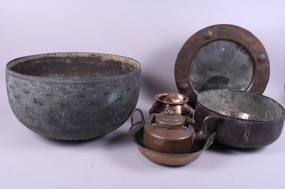 A quantity of copper, including a large bowl, a copper kettle, trays, a mirror, etc
