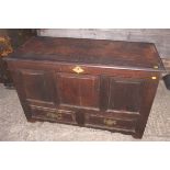 An early 18th century oak triple panel front mule chest, fitted two drawers, on stile supports,