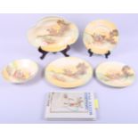 Five pieces of Royal Doulton "Ploughing" pattern china, including plates, a draining bowl and a