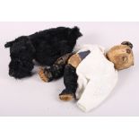 An early 20th century straw filled teddy bear and a West Highland Terrier soft toy