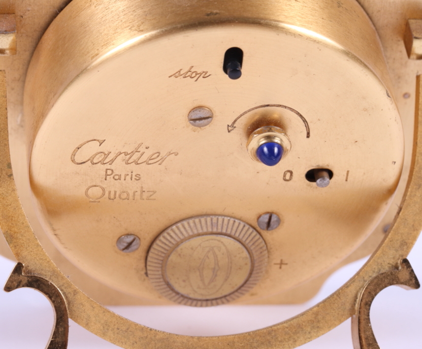 A Cartier steel and gilt cased travelling alarm clock, white enamel dial with Roman numerals and - Image 4 of 4