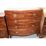 An early 19th century mahogany bowfront chest of two short and three long graduated drawers, on