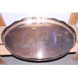 A silver plated two-handled oval tea tray with pierced gallery, 24" wide