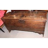 A late 17th century oak boarded coffer with chip carved details, on panel end supports with original