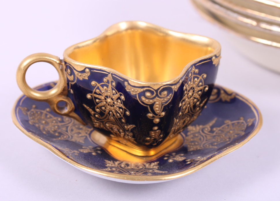 A pair of Coalport blue and gilt cabinet cups and four Ridgeways saucers with floral and gilt - Image 2 of 5