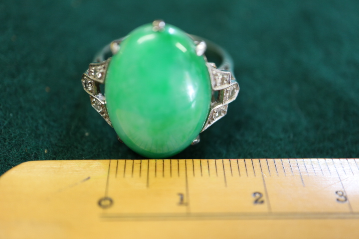 An Art Deco white metal ring, set jade cabochon, flanked three diamonds to each shoulder, ring - Image 5 of 10