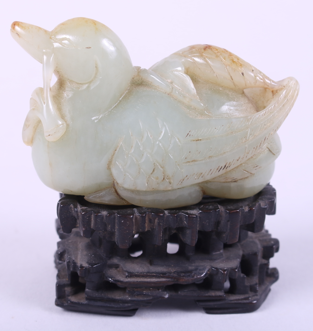 A Chinese carved pale celadon jade figure of a duck, 2 3/4" long, on associated carved hardwood - Image 2 of 22