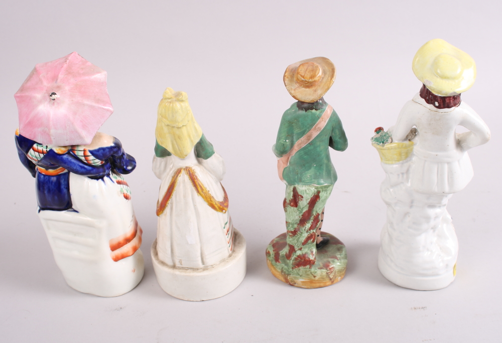 A 19th century Staffordshire figure, fish wife, a smaller figure, Spanish lady, and five other - Image 6 of 7