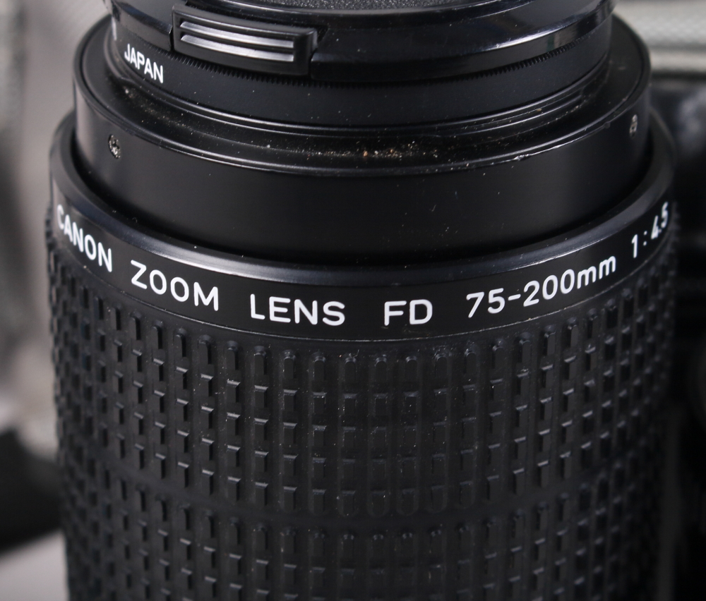 A Canon AE-1 "Program" camera with a FD 135mm lens, a Canon FD 50mm lens, a Canon Ranger Auto 2X, FD - Image 2 of 7