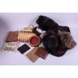 Three fur hats, a pair of fur gloves, a stole, various skin wallets, etc